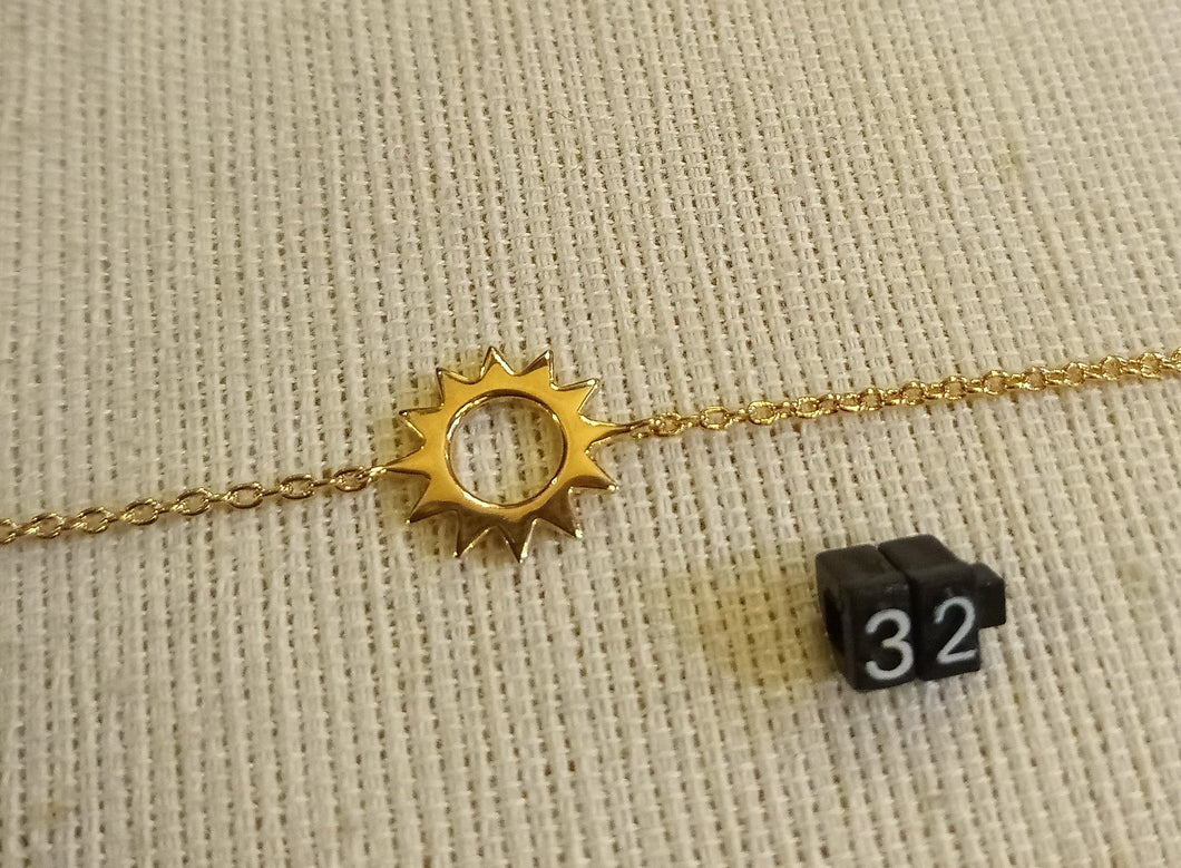 Bracelet chaîne réglable plaqué or soleil lisse