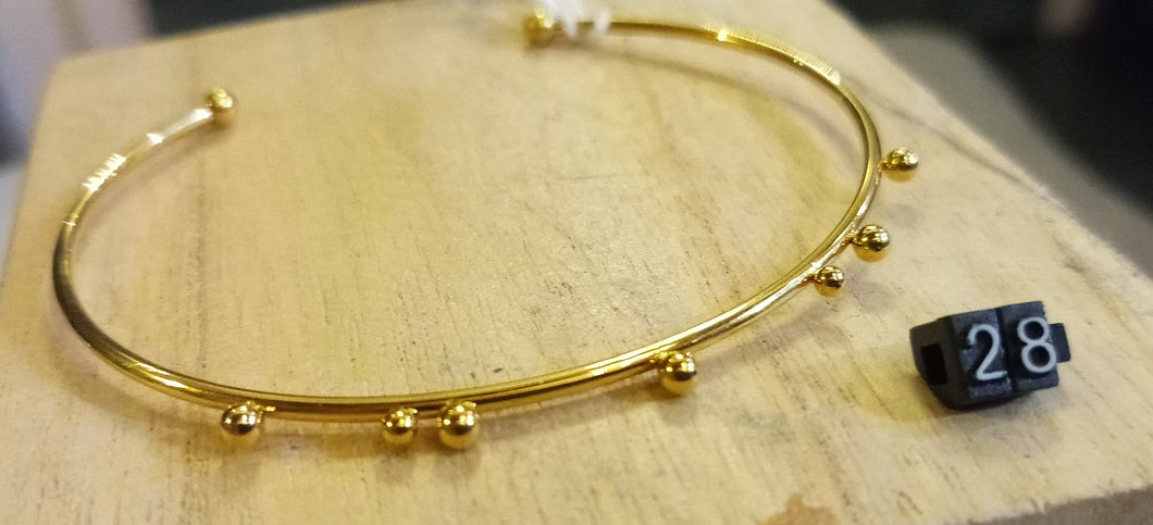 Bracelet jonc réglable acier inoxydable doré lisse avec billes asymétriques